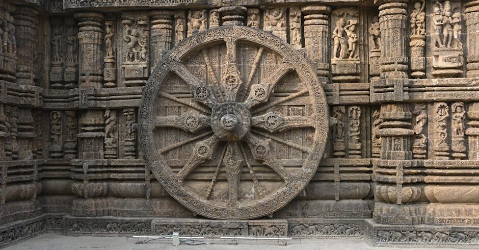 Wheel and Sculptures on the Wall of the Konark Sun Temple, Puri, Odisha, India